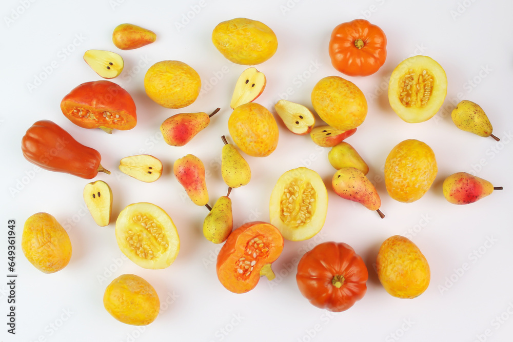 Pumpkins, melons and pears on a plane, top view. Autumn background. Yellow-orange background. Pumpkins, melons and pears on a plane, top view. Autumn background. Yellow-orange background.