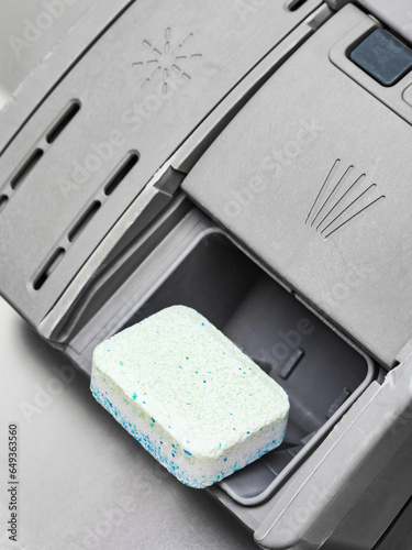 Dishwashing detergent tablet in dispenser