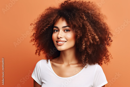 Woman with brown natural afro-textured curly hair. Healthy hair. 
