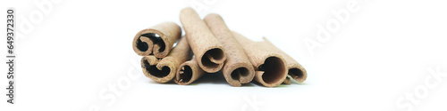 Cinnamon sticks isolated on white background for banner use photo