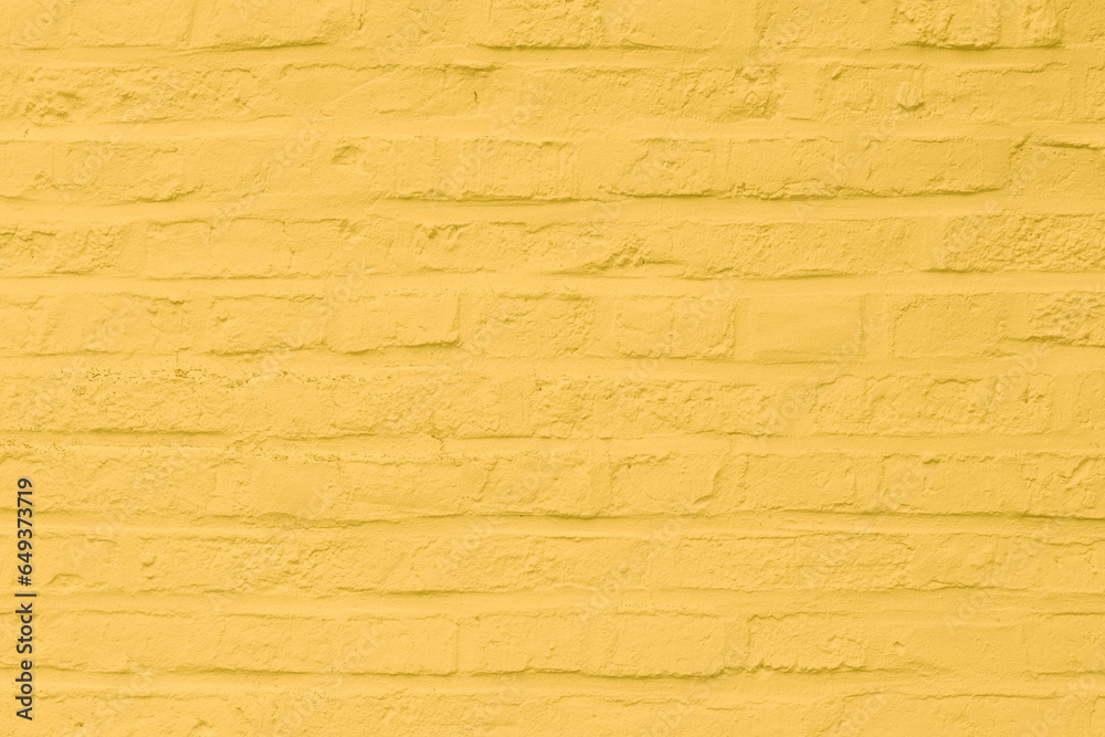 background of yellow painted brick wall background of yellow painted brick wall
