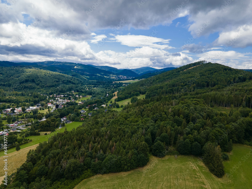 Landscape of Jeseniky mountains with village in valley. Czech republic