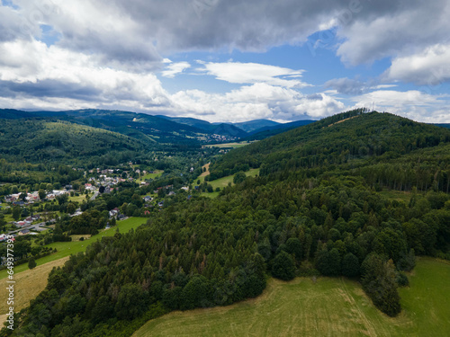 Landscape of Jeseniky mountains with village in valley. Czech republic © Luk