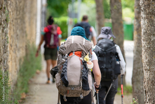 With their backpacks and caps doing the Camino de Santiago