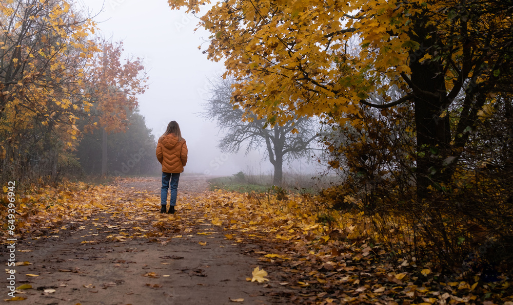 Children walk in the autumn park Children walk in the autumn park