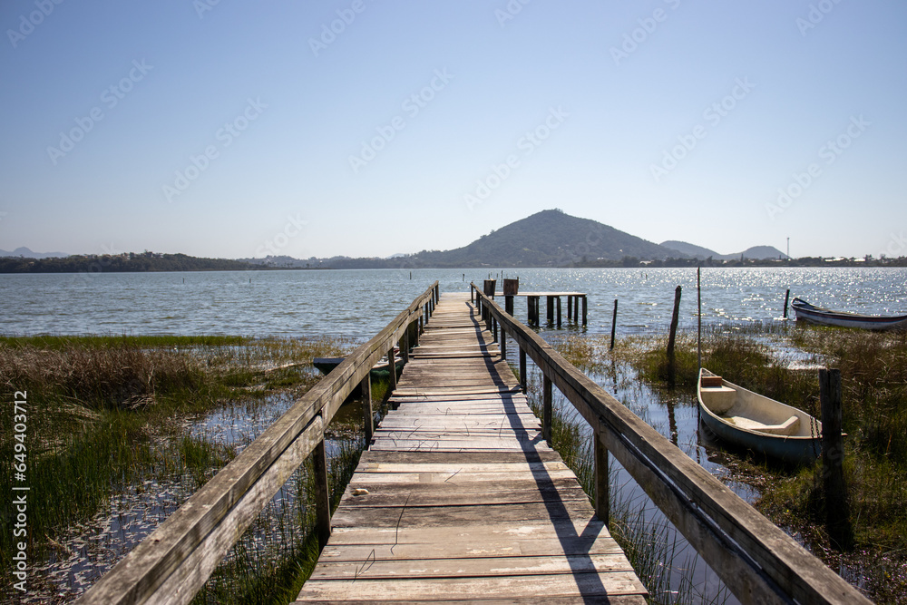 Wooden deck leading to the lagoon in Barra de Ibiraquera, Imbituba, Santa Catarina, Brazil