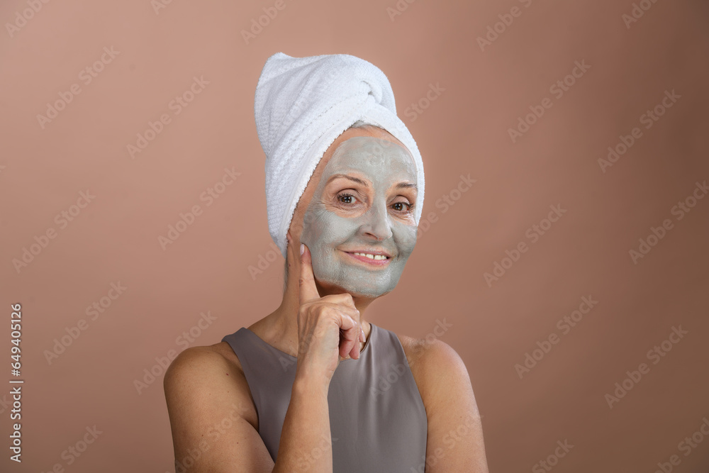 Portrait of happy senior woman with face-mask, selfcare and skin routine concept. Portrait of happy senior woman with face-mask, selfcare and skin routine concept.