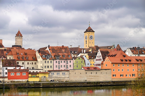 Clock tower and colorful old buildings in Regensburg Germany