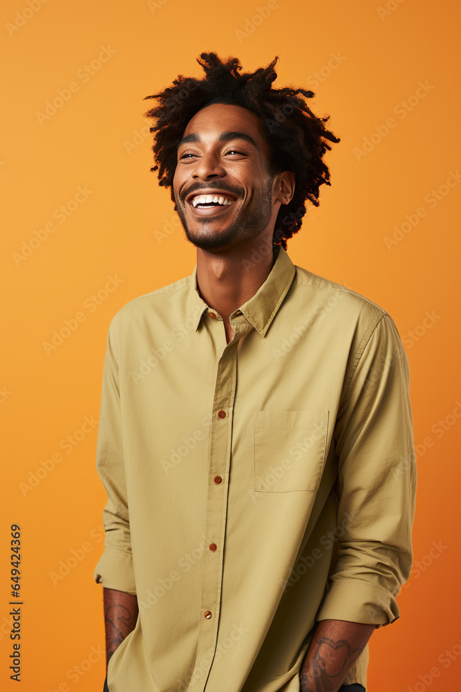 Portrait of happy black adult man looking at camera and smiling while standing on orange background. Portrait of happy black adult man looking at camera and smiling while standing on orange background.