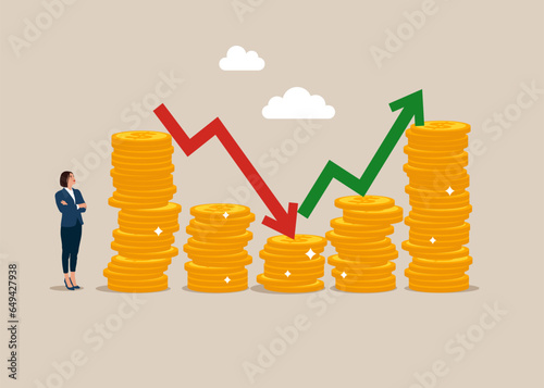 Businesswoman standing near coin piles and arrow red green graph chart up and down. Risk, fluctuation in stock market and cryptocurrency. Analyze data, profit and Company growth. 