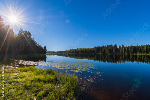 Tranquil morning sunrise over Andy Bailey Lake, British Columbia, Canada