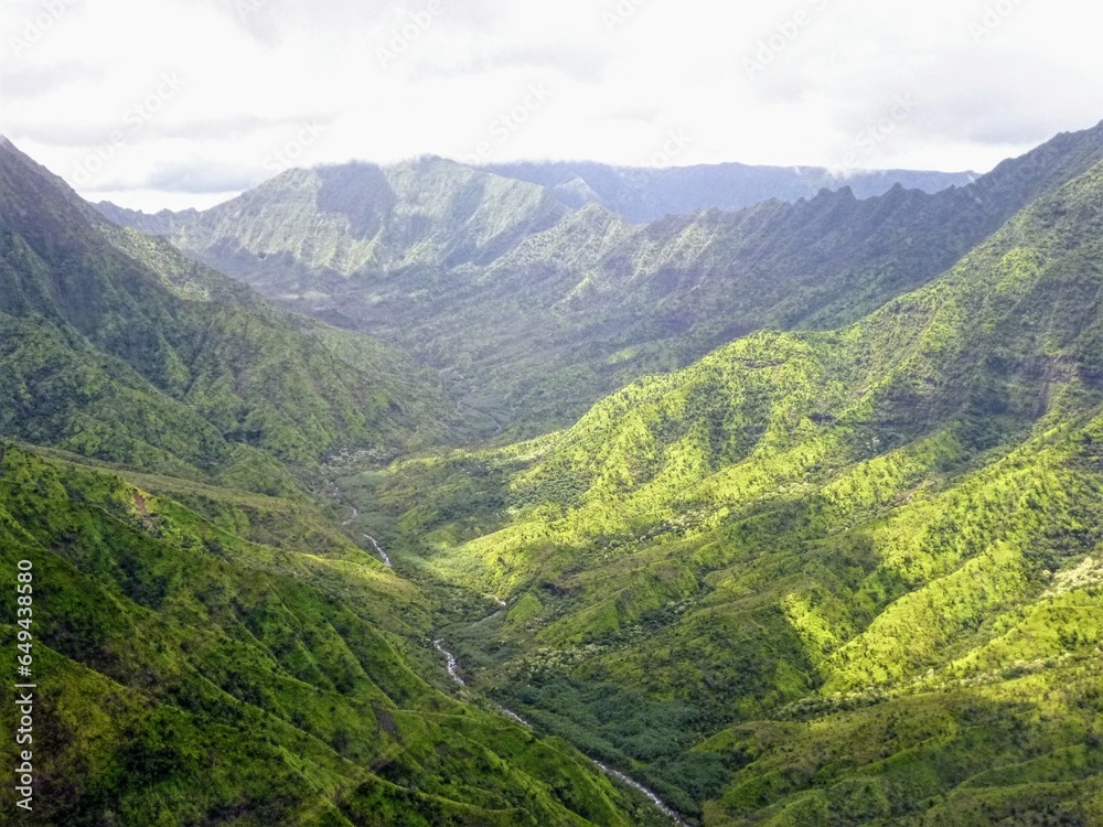Sky view of the mountains and valleys of Kauai 