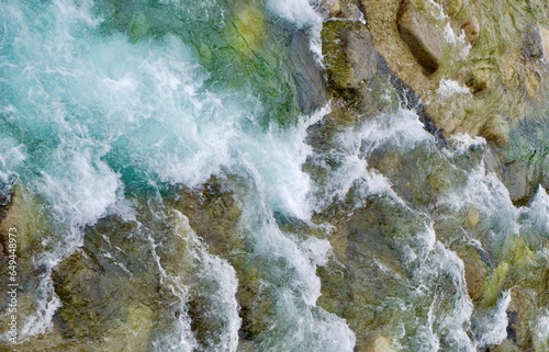 Mountain river surface, natural water background, aerial view. Fast pure flow stream