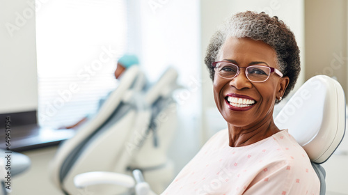 Portrait of a happy dark-skinned adult woman in a dental office. African American woman undergoes a consultation with a dentist in a specialized clinic. Dental health concept.