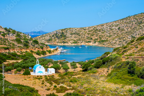 Scenic landscape with a white church of Agios Ioannis and a small harbor on Lipsi island, Greece photo