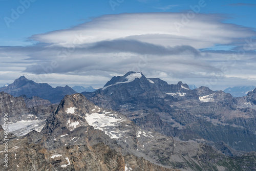 view of Gran Paradiso mountain and glacier from Ciamarella peak. cloudy sky  mountains landscape. italian Alps