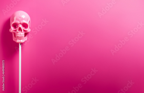 A colorful lollipop in the shape of a skull, with lot of negative space for adding text or captions photo