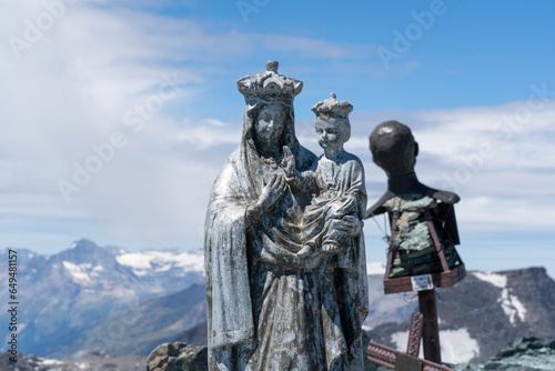 Madonna della Ciamarella statue and saint Leonardo Murialdo bust on top of Ciamarella mountain peak. Italian Alps