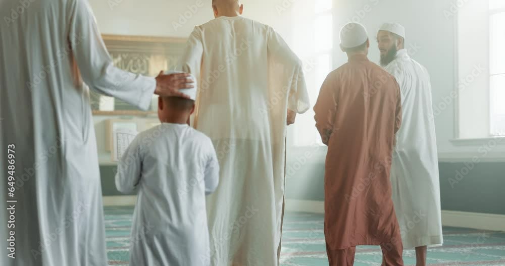 Muslim, child and men in a Mosque for spiritual religion together as a family to worship Allah in Ramadan. Islamic, Arabic and holy people with kid in peace or respect for gratitude, trust and hope