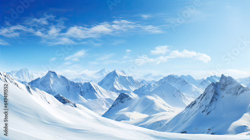 A beautiful view of a big snowy mountain range with a blue sky. Ski resort background. 