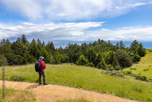 USA, California, Marin Headlands, Senior man hiking Dipsea Trail photo