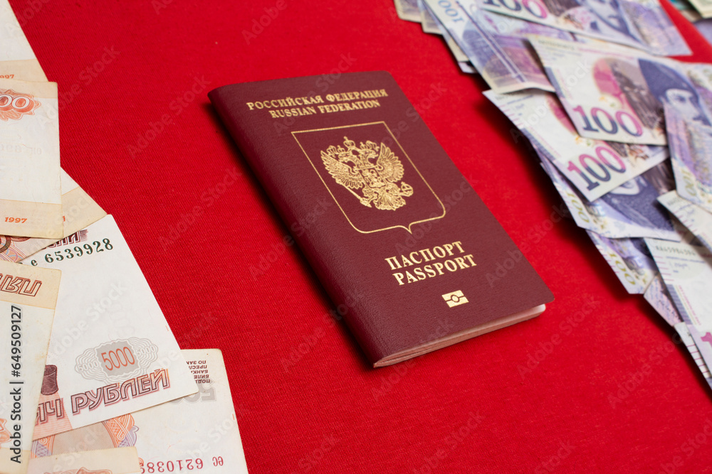 biometric-passport-on-red-textile-background-5000-rubles-100-gel