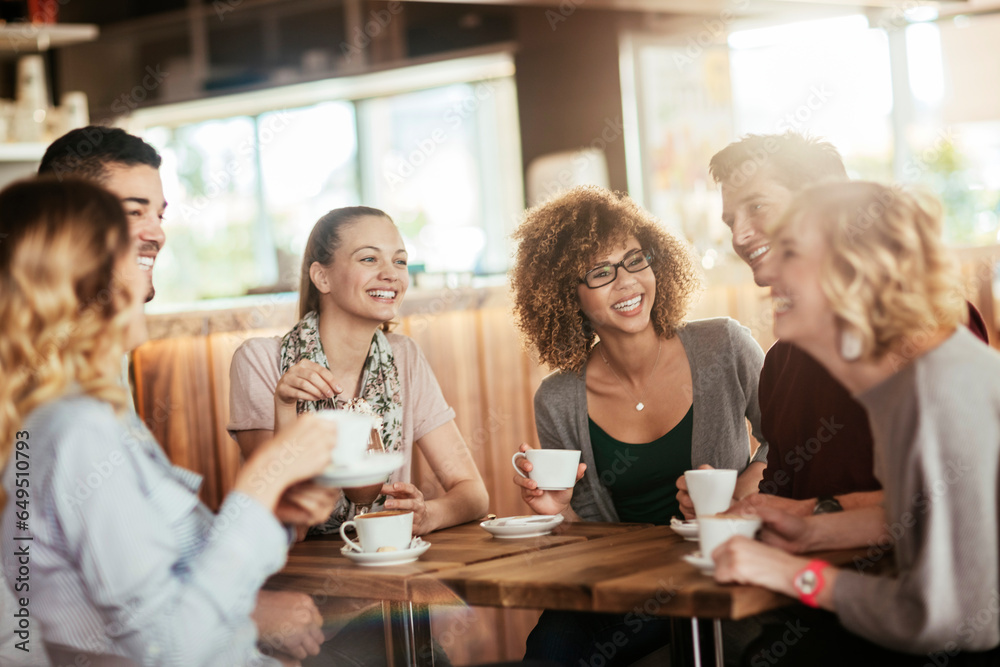 Young and diverse group of people having coffee together at a cafe in the city Young and diverse group of people having coffee together at a cafe in the city