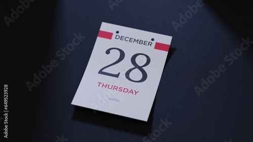 December 28th Calendar date. scraps of calendar paper on the floor photo