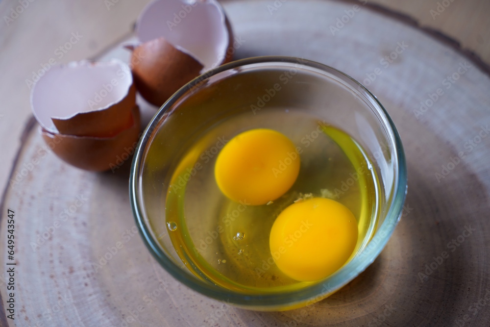 fresh two raw egg yolks in a glass bowl at wooden background.
Egg Yolk contain protein, vitamins, minerals, omega3 and other nutrients. fresh two raw egg yolks in a glass bowl at wooden background.
Egg Yolk contain protein, vitamins, minerals, omega3 and other nutrients.