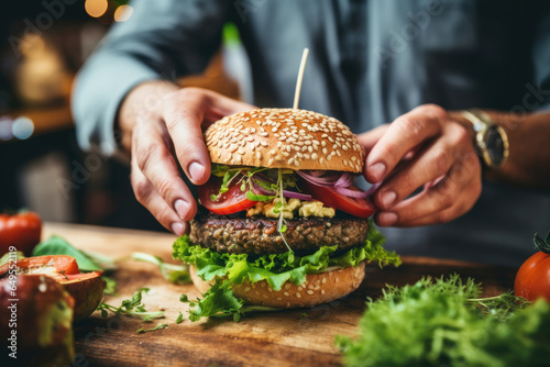 Close-up of a man cooking vegan burger