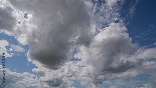 Blue sky white clouds. Puffy fluffy white clouds. Cumulus cloud cloudscape timelapse. Summer blue sky time lapse. Nature weather blue sky. White clouds background. Cloud time lapse photo