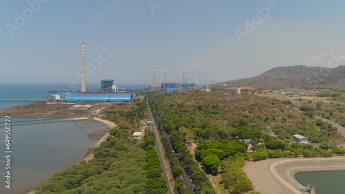 power station by sea with smoking pipes  paiton java  indonesia. aerial view power plant in asia.