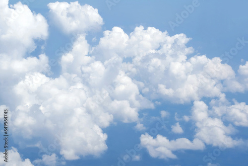 blue and white cumulus clouds from above with softness and atmosphere 