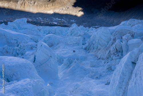 Climbers walking on Khumbu icefall on the way to the top of Mount Everest 