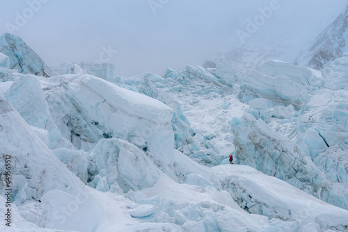 Climbers walking on Khumbu icefall on the way to the top of Mount Everest 