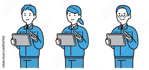 作業着を着てタブレットを操作する男性と女性