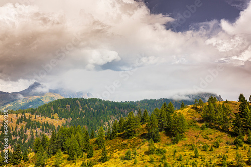 Landscape in the Dolomite Mountains, Italy, in summer, with dramatic storm clouds