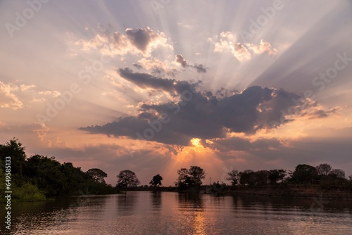 Beautiful sunset clouds and landscape by Pixaim River, Pantanal photo