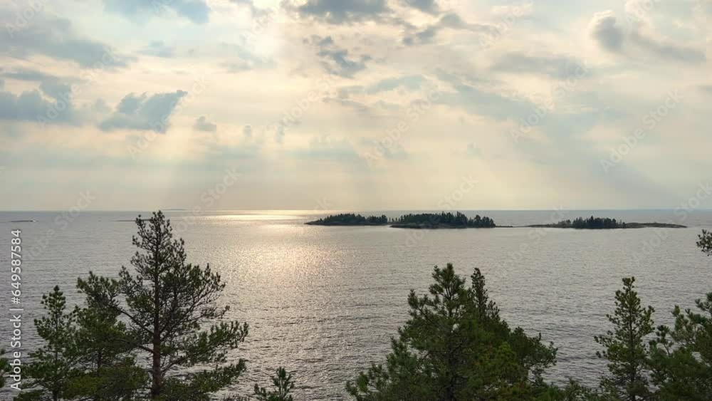 Russia, Karelia, Lake Ladoga, Koyonsaari. View of the coast of the island in a cold lake. Beautiful nature of the Republic of Karelia. Stunning panoramic view of the Ladoga Skerry Islands. 4K Russia, Karelia, Lake Ladoga, Koyonsaari. View of the coast of the island in a cold lake. Beautiful nature of the Republic of Karelia. Stunning panoramic view of the Ladoga Skerry Islands. 4K