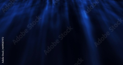 This motion stock graphic shows a dark blue underwater space.