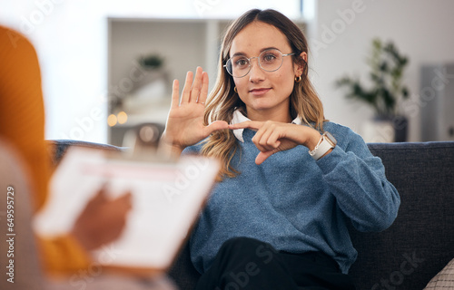 фотографія Sign language, speech therapy and woman talking to therapist in a consultation or counseling conversation