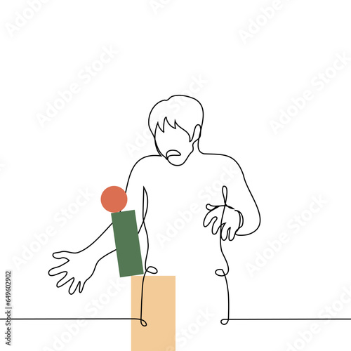man froze in confusion in front of a falling stack of figures - one line art vector. concept horror and loss from wrong actions leading to failure, unbalanced life metaphor