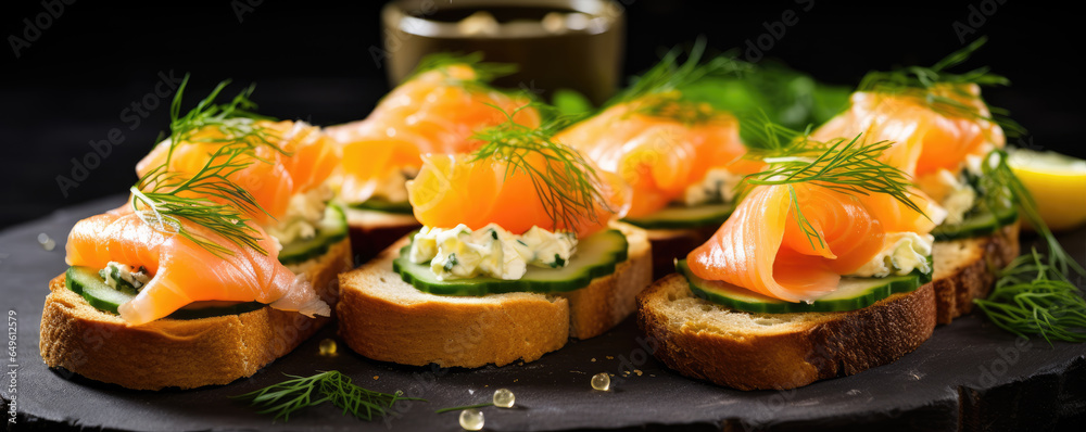 Fresh canapes topped with cheese, smoked salmon on bread.