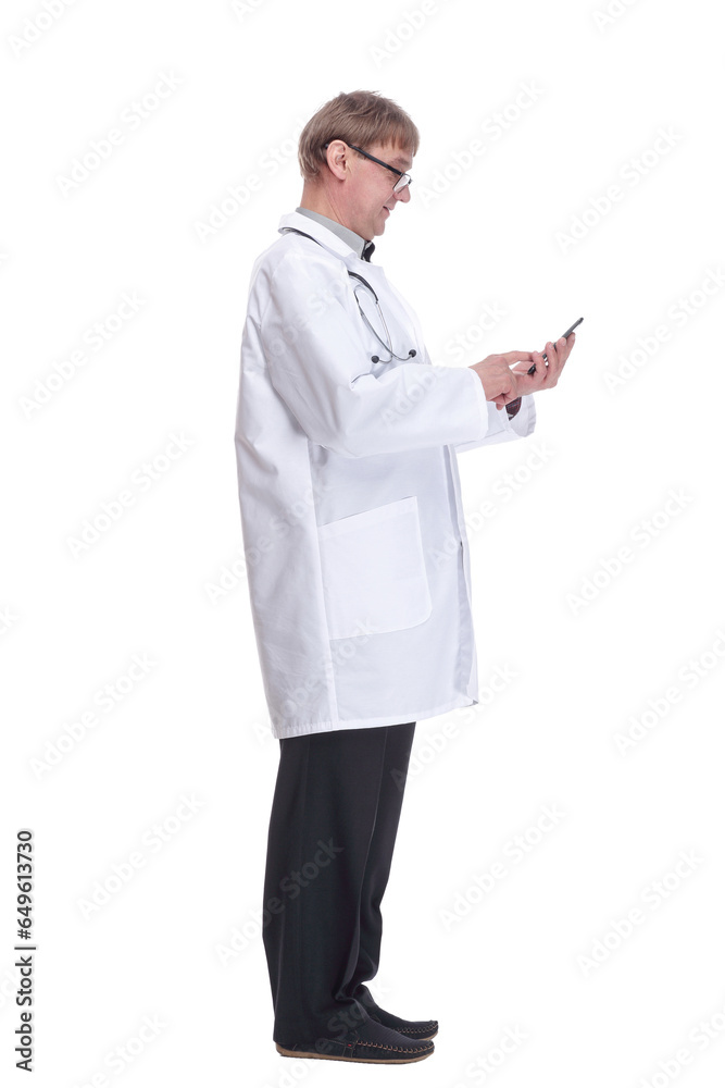 smiling doctor with a smartphone looking at you . smiling doctor with a smartphone looking at you .