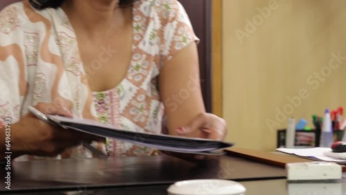 Businesswoman passing document report. Ladies having important discussion in conference room meeting, personal office, cabinet.