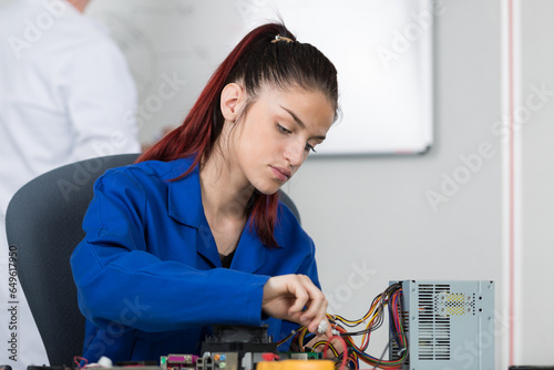 Wallpaper Mural young female electrician at work Torontodigital.ca
