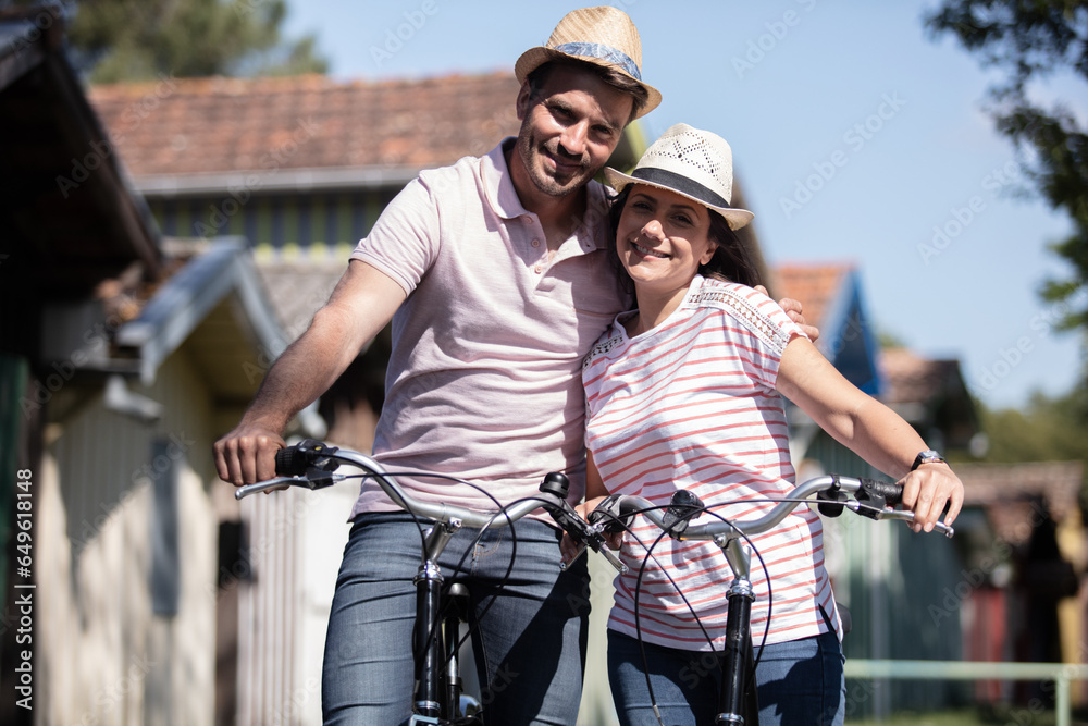 couple going for a bike ride on a sunny day couple going for a bike ride on a sunny day