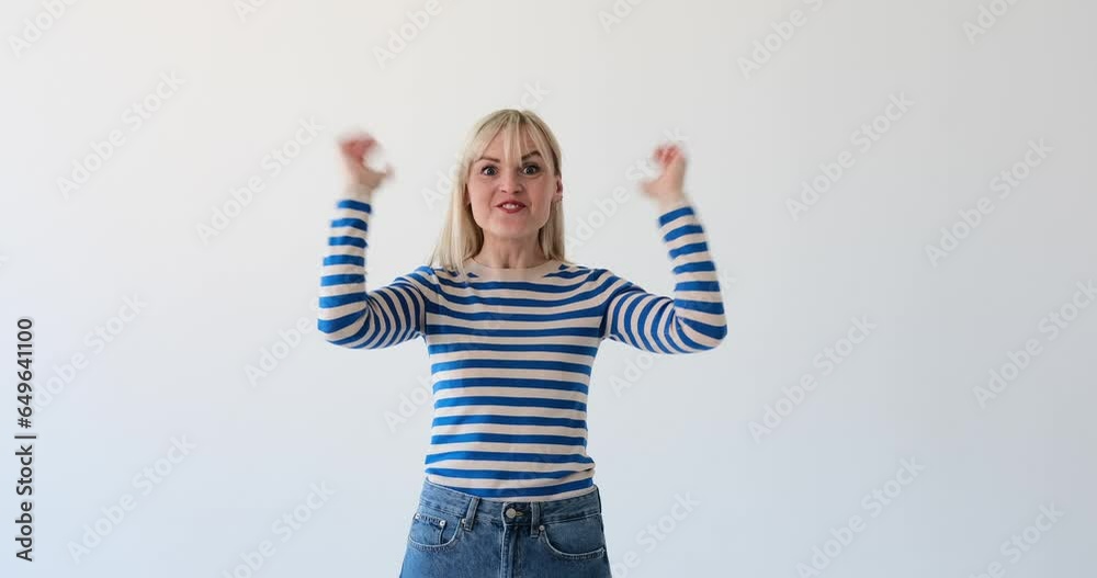 Energetic and vibrant woman is seen on a clean white backdrop, showcasing her enthusiasm as a blogger. She may be talking, gesturing, or displaying high energy while engaging with her audience. Energetic and vibrant woman is seen on a clean white backdrop, showcasing her enthusiasm as a blogger. She may be talking, gesturing, or displaying high energy while engaging with her audience.