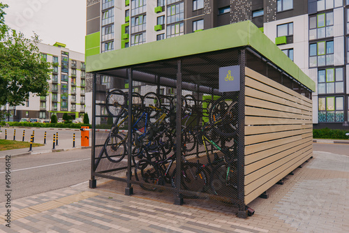 Bicycle garage. Bicycles in a cage on the street. Special garage-cage for bicycles. Bicycle storage device. photo