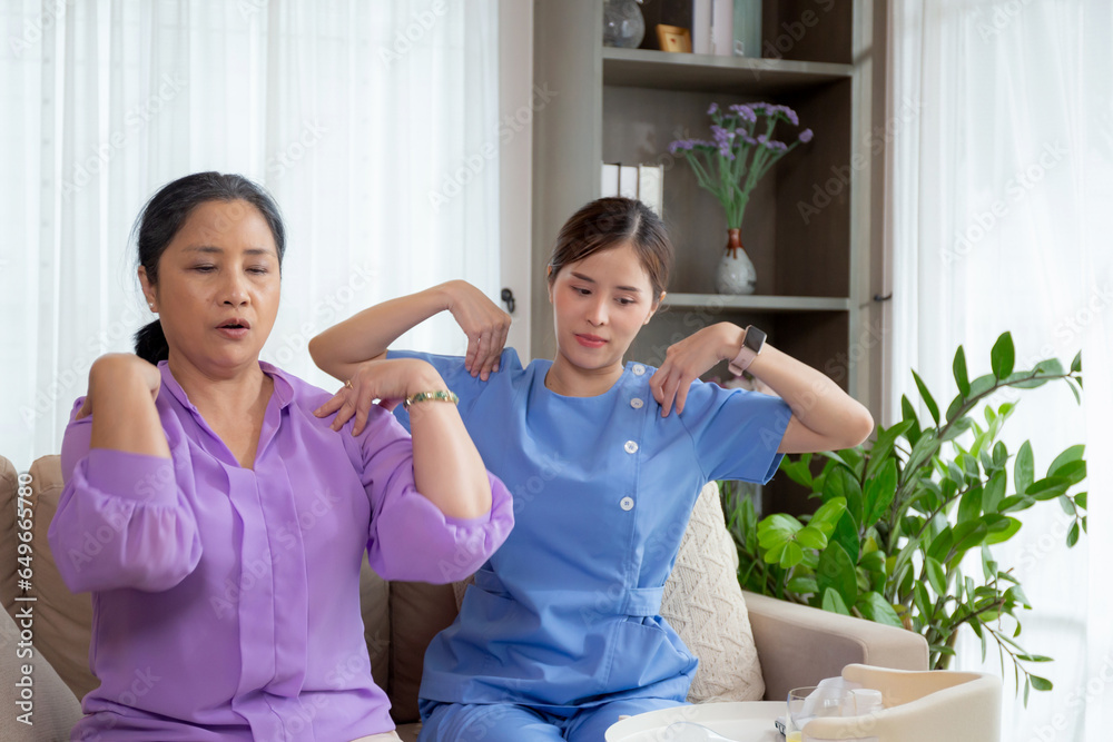 Asian caregiver woman or nurse training senior woman warmup for exercise while physical therapy and rehabilitation, caretaker or physiotherapist helping elderly workout with shoulder, medical concept. Asian caregiver woman or nurse training senior woman warmup for exercise while physical therapy and rehabilitation, caretaker or physiotherapist helping elderly workout with shoulder, medical concept.